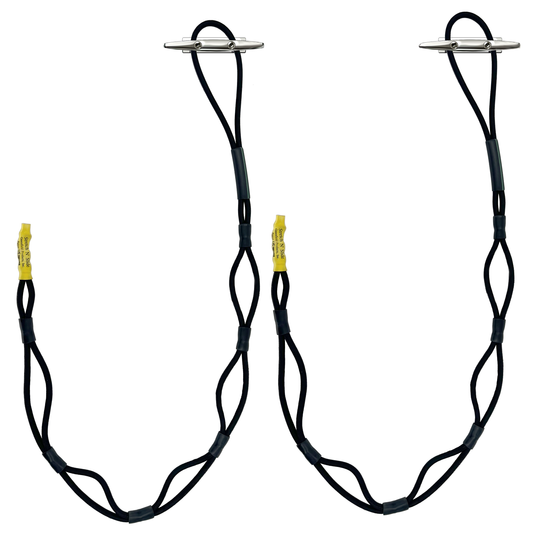 Bungee dock lines secured over stainless dock cleats at a dock